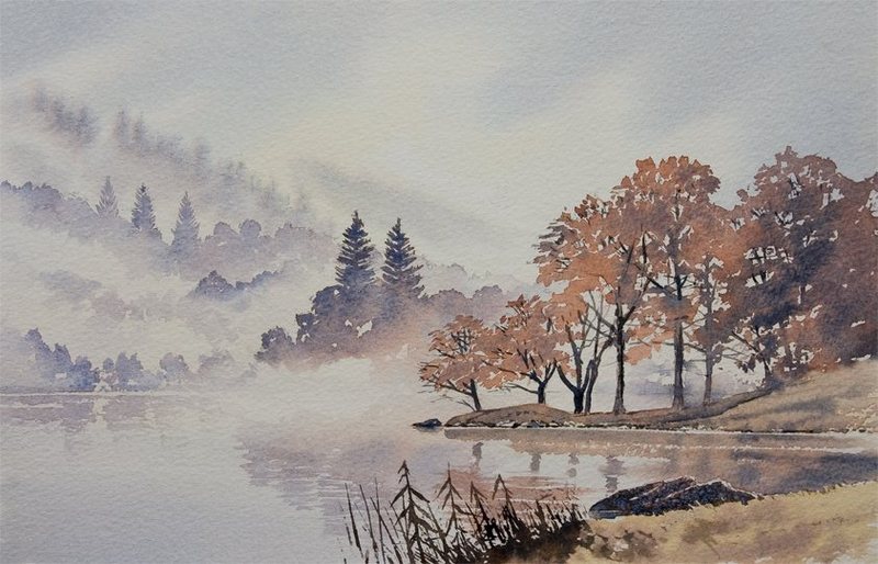 Autumn trees half hidden in mist beside Rydal Water, with reeds in the foreground